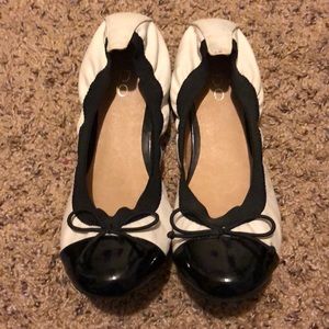 Black and white cap toe flats